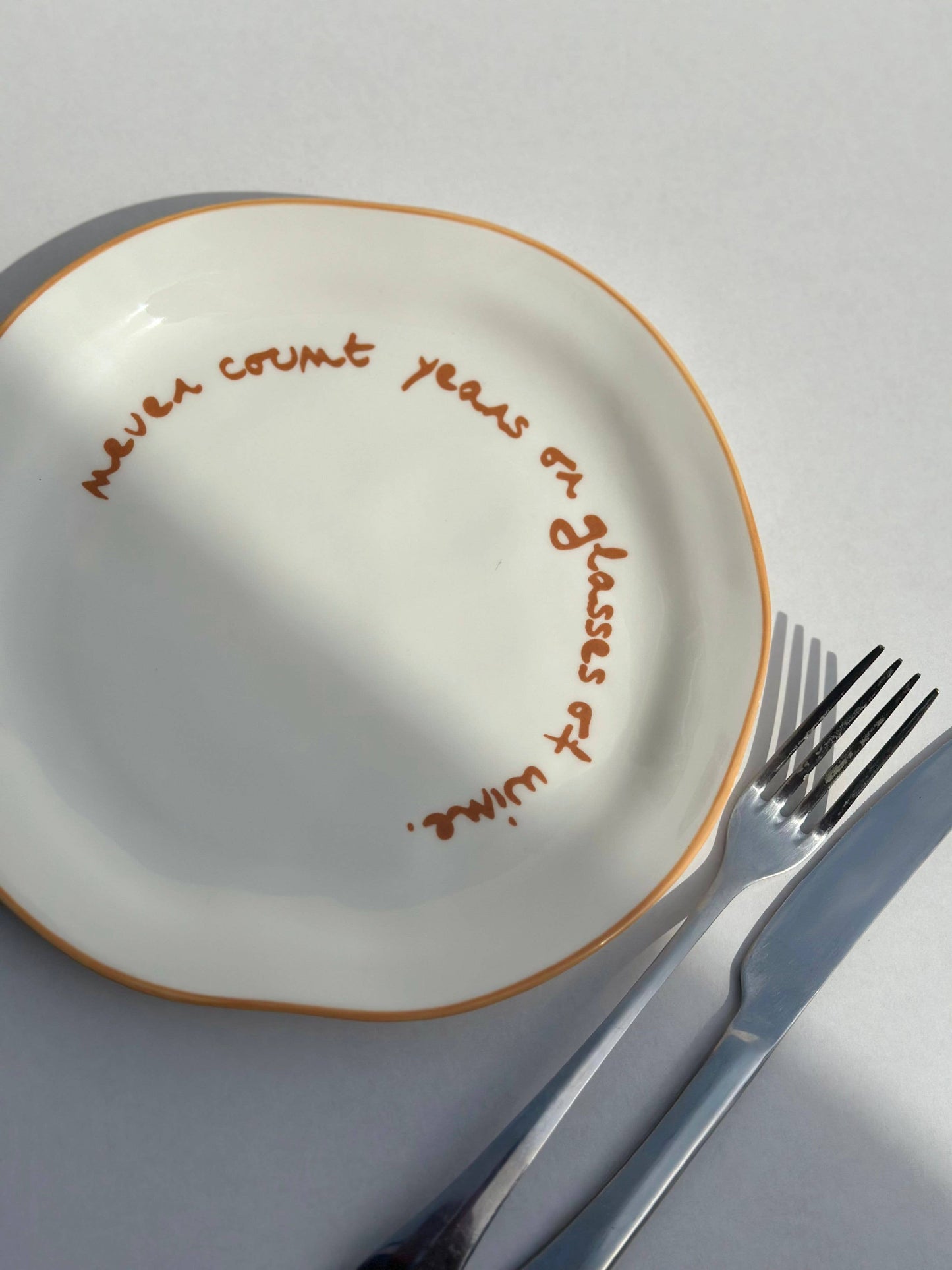 Statement Plate - 'never count years or glasses of wine.'